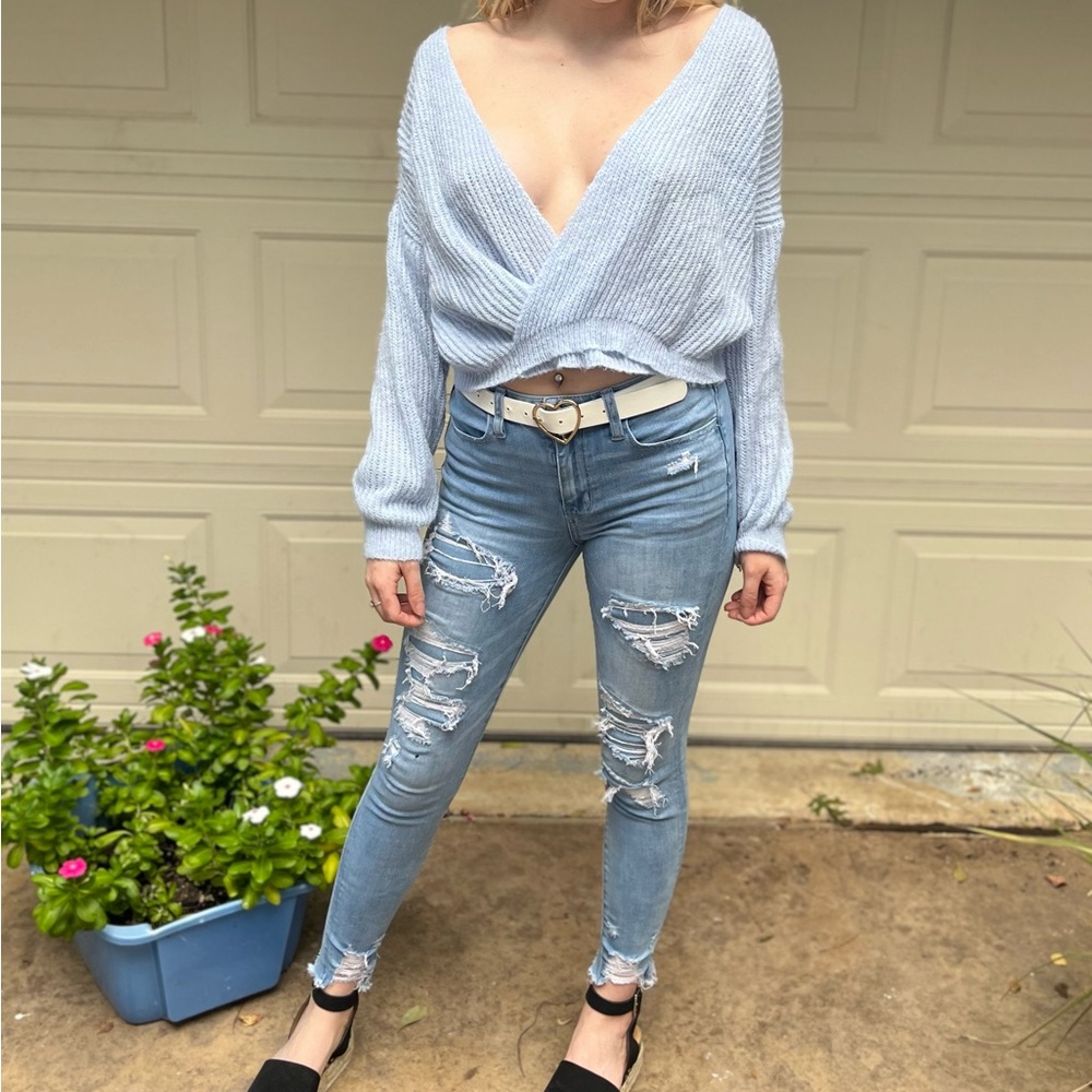 light blue medium sized deep v neck sweater
